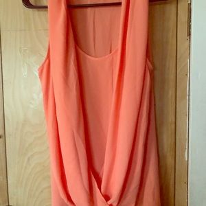 Orange sleeveless blouse with a stylish front